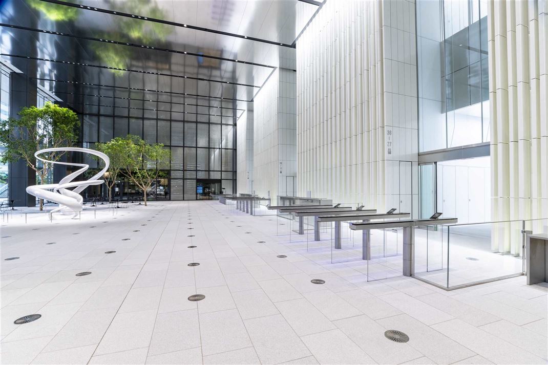 A long bank of UG series gates in a tower lobby